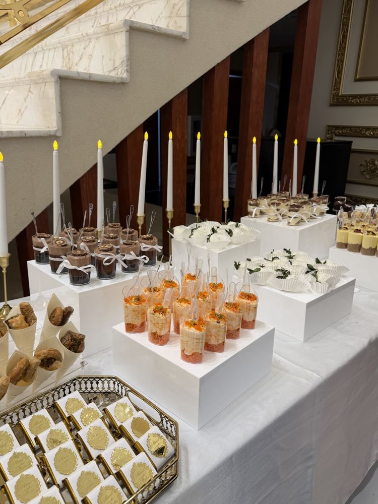 Candlelit dessert table at an event